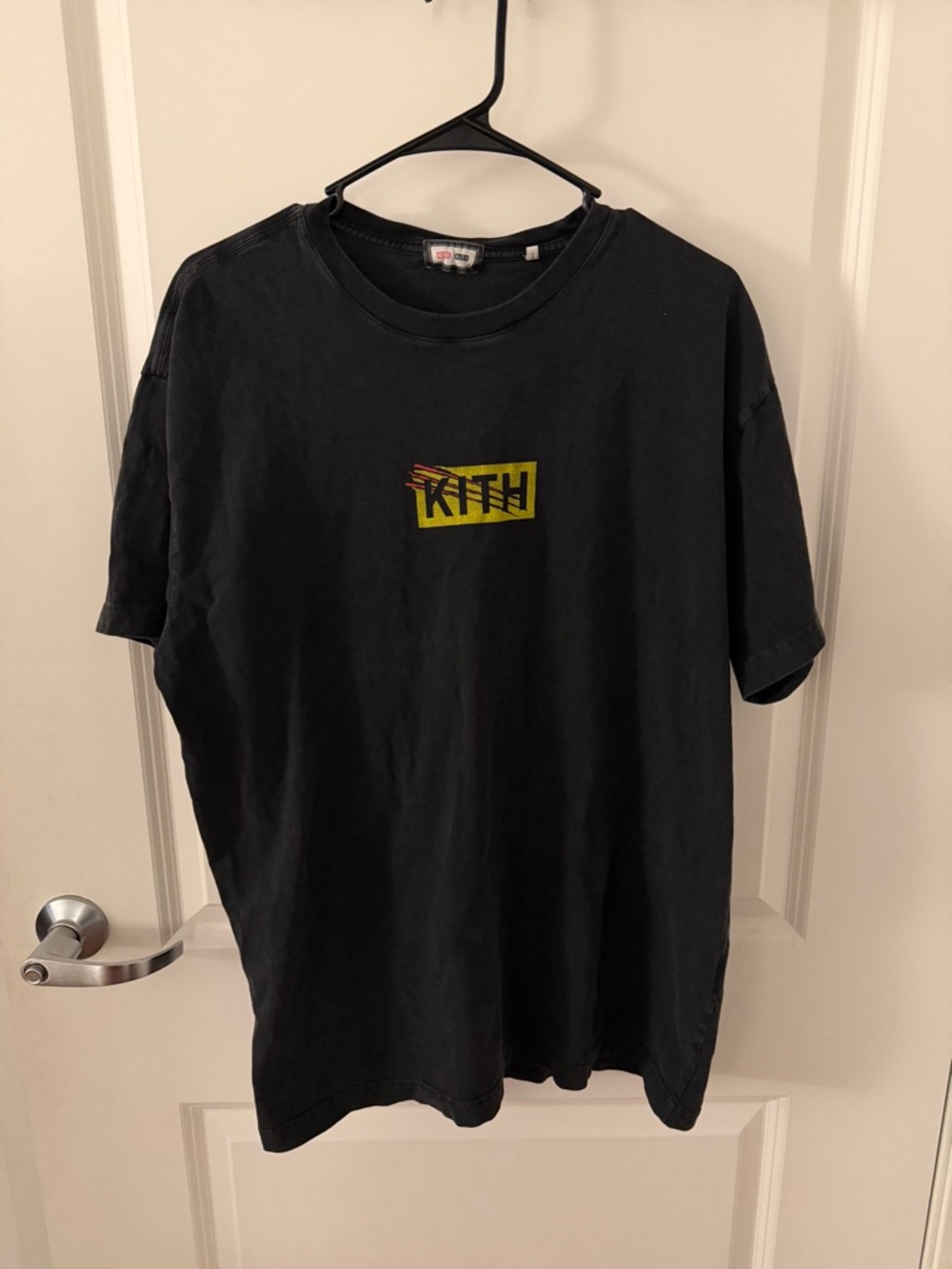 Kith Black Tee with Marvel Collaboration Tag